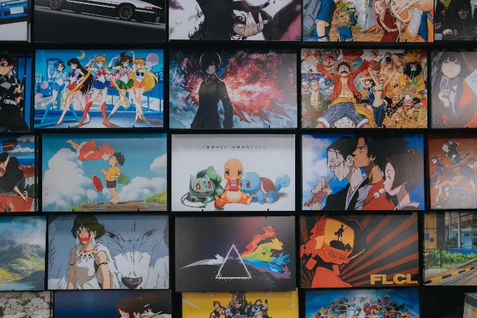 anime character collage photo on black wooden shelf